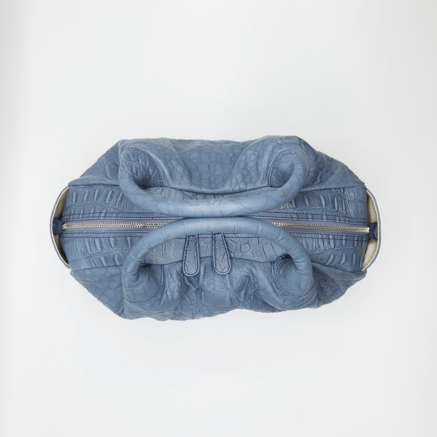 Gray sustainably sourced, crocodile embossed Turkish leather. This medium-sized handbag, tote, and messenger is expertly crafted to our exacting standards.